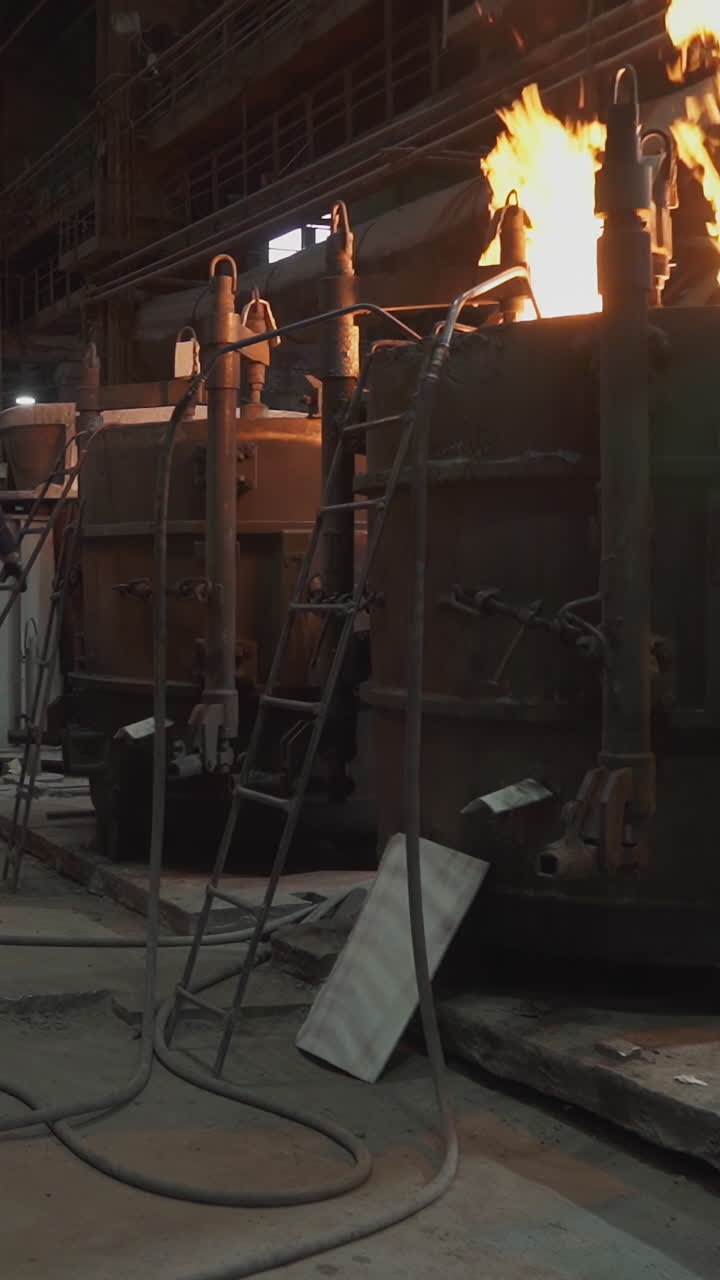 Industrial Factory Scene with Fire and Workers