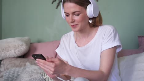 joyful girl listening music in headphones