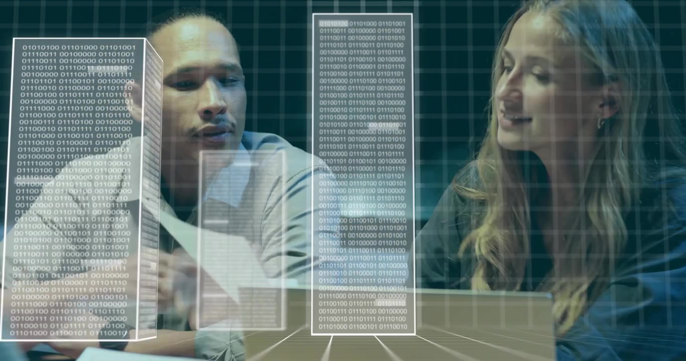Coworkers examining holographic data blocks triggered by analyst gesture for tech team review