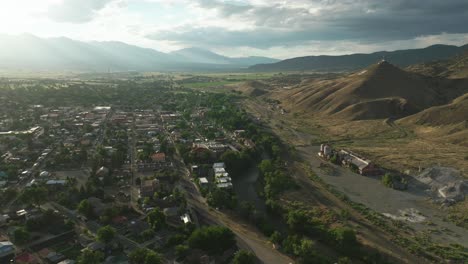 Aerial-cinematic-drone-sunset-golden-hour-summer-downtown-Salida-Lime-Mill-Colorado-near-Buena-Vista-Arkansas-River-Riverside-Park-Scout-surfing-wave-biking-hiking-rafting-Rocky-Mountain-back-motion