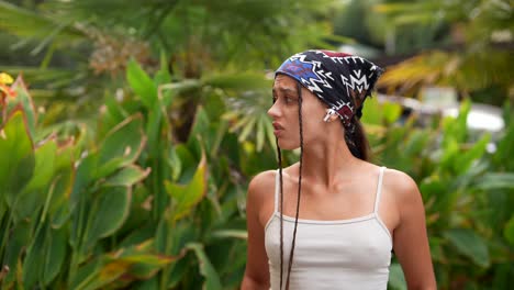 young woman in a tropical park