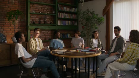 students discussing in a library