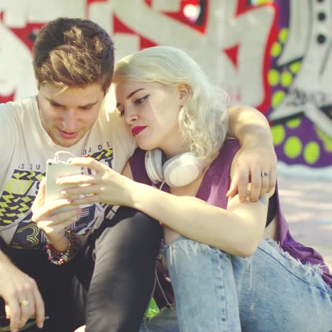 young couple relaxing in an urban park