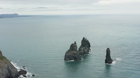 reynisdrangar rock stacks at south shore of iceland, tourist attraction