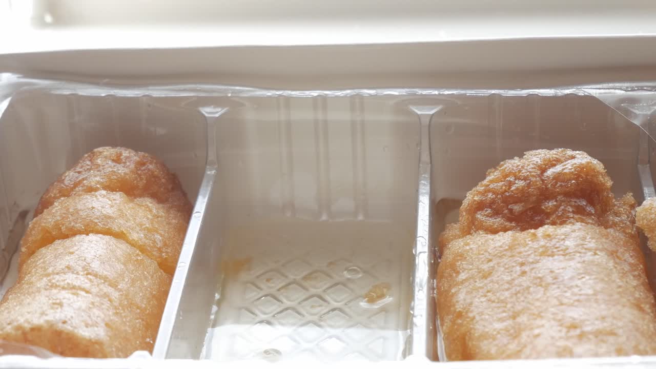 Golden Chachepo sweet from Linares Jaén, Spain, dipped in syrup or glaze