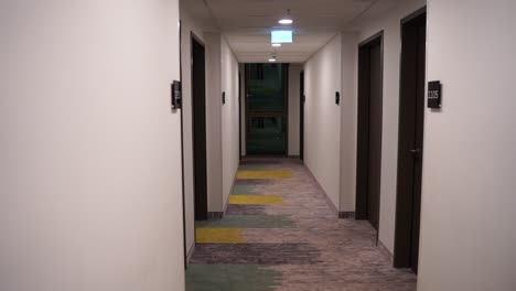 hallway of a hotel in germany with white walls and dark doors düsseldorf