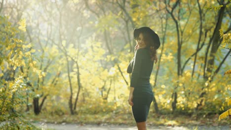 woman posing in park. happy young woman posing in autumn park