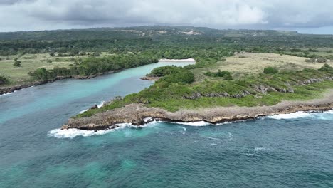 Aerial-view-around-the-rocky-bay-at-Playa-Caletón-in-Rio-San-Juan,-Dominican-republic