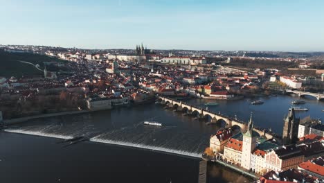 flying over prague city old town rooftops, charles bridge over river