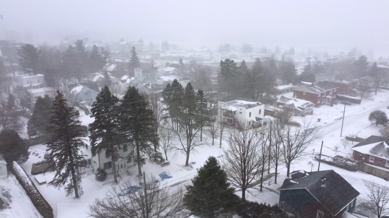 Heavy snowfall Orford Canada neighbourhood harsh winter weather, aerial drone