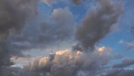 a time lapse video of a windy and cloudy sky during sunset