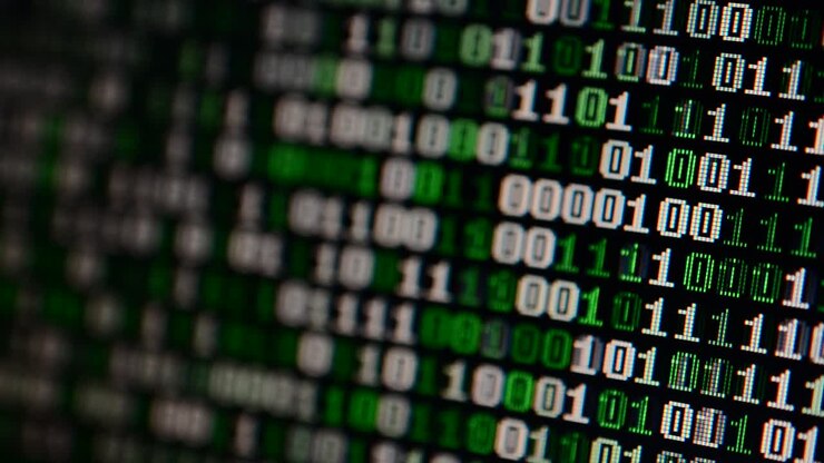 Binary code on the monitor screen. Shooting of a binary code, background