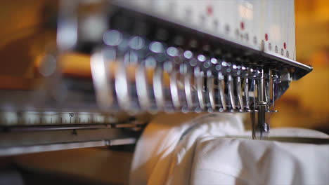 commercial embroidery machine embroidering logo on a t shirt