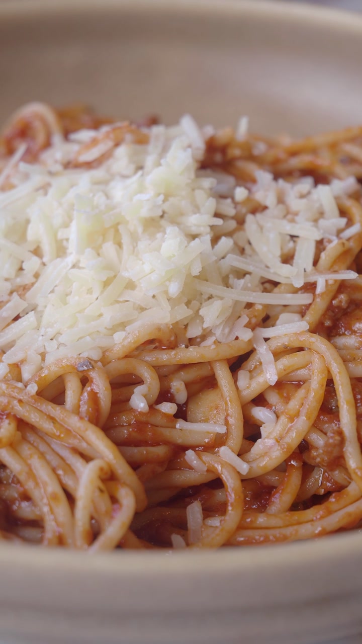 Delicious Spaghetti with Red Sauce and Grated Parmesan Cheese