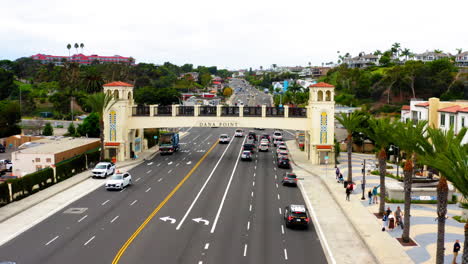street scene in dana point with overhead bridge and traffic