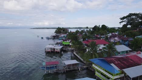 aerial view showcasing bocas del toro on bastimentos island in panama. coastal houses on stilts overlooking the serene water.