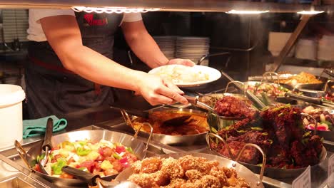 hand serving food at melbourne market stall