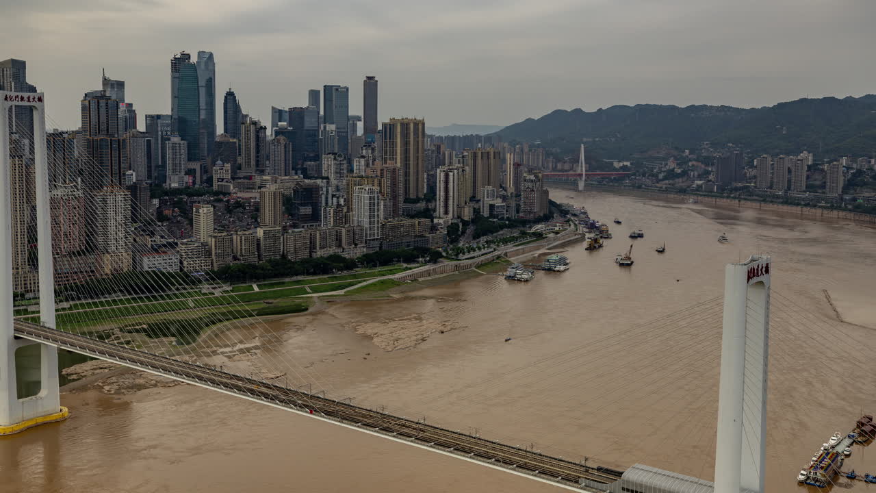 Timelapse of the amazing Chongqing cyberpunk city skyline from a high vantage point wirh the yangtze river