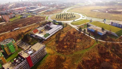 drone flight over a roundabout in pilsen, czech republic, central europe. transportation and traffic in modern city.