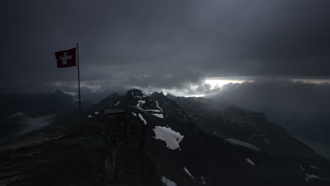 swiss alps mountain peak under stormy clouds