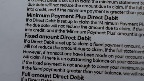 close-up of text regarding payment methods, slow zoom out reveals more details