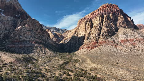 tilting reveal of red rock valley and blue skies near red rock canyon in las vegas, nevada