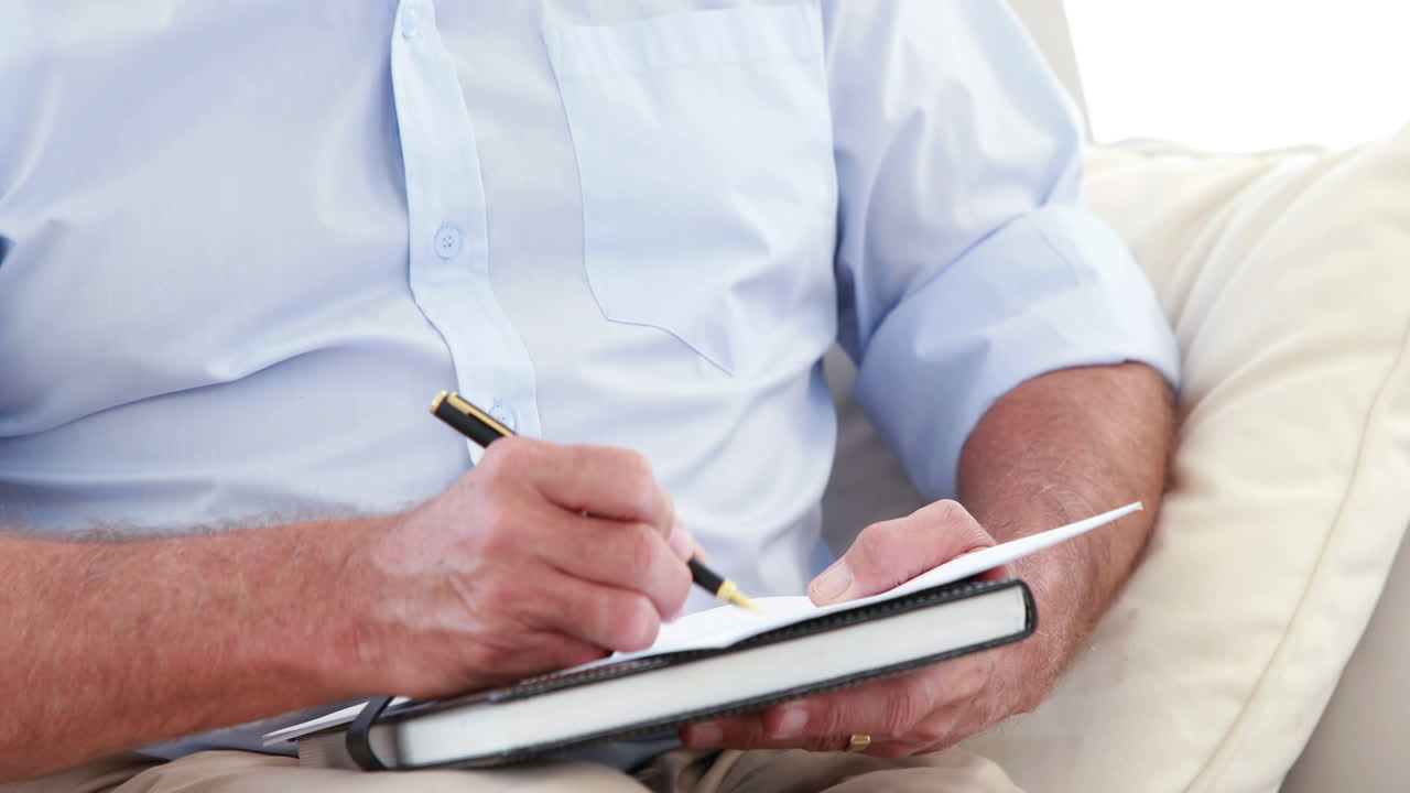 Close up view of a therapist man taking notes