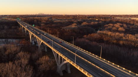 drone shot over mendota heights bridge, tracking backwards, demonstrating the huge scale of the structure