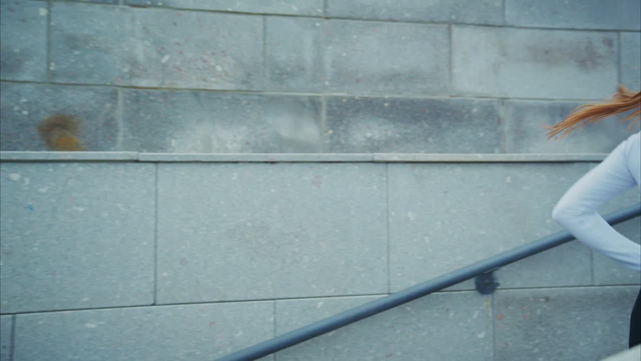 Woman running with headphones in the city