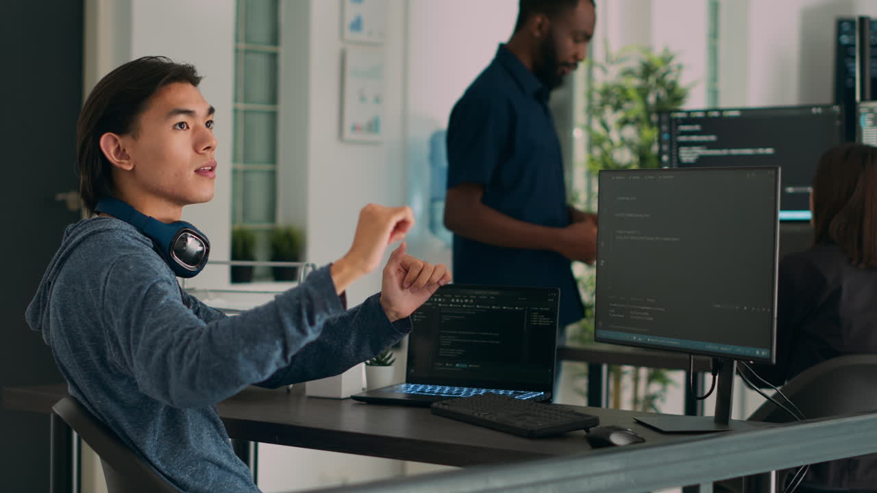 Software programer writing code and using holographic program with augmented reality