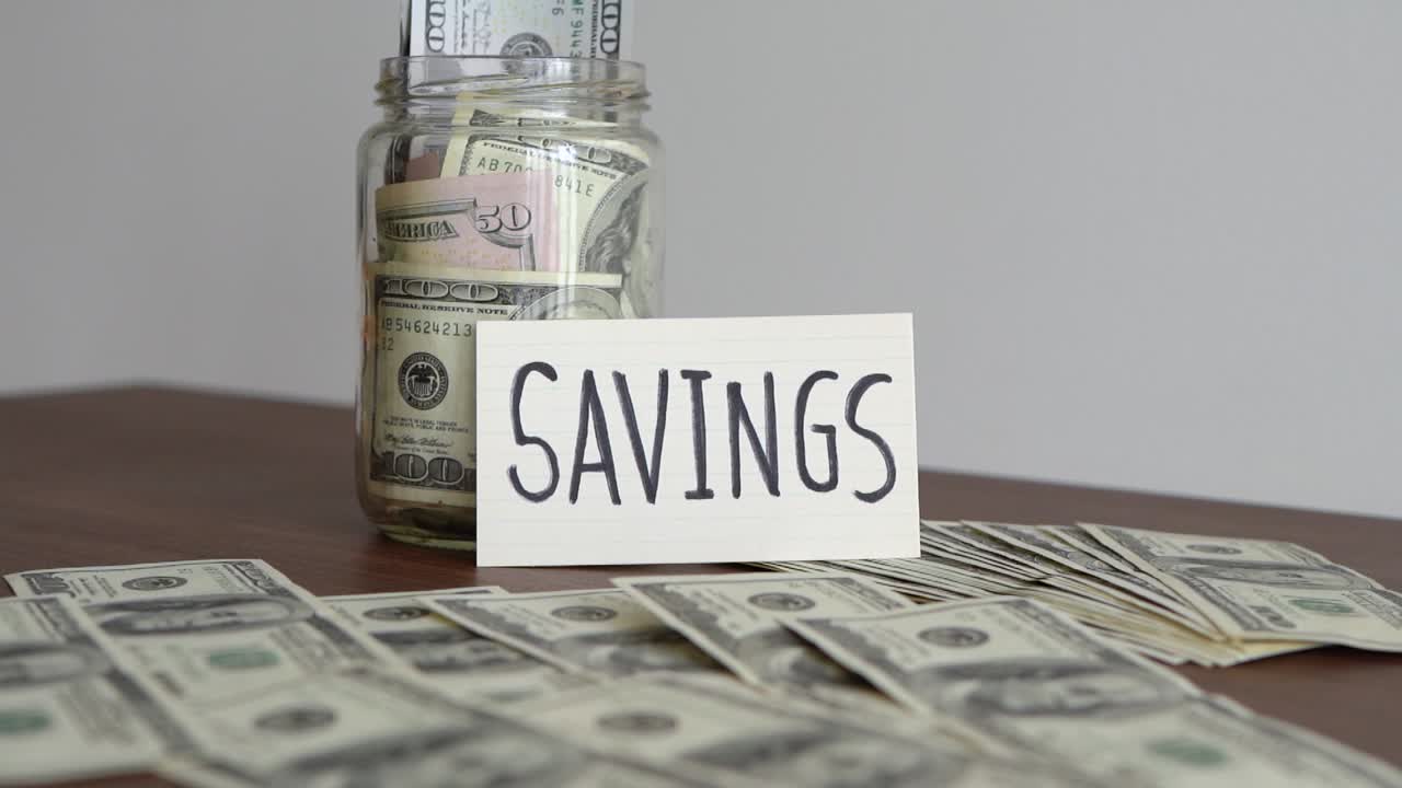 Saving money for the future in a glass jar