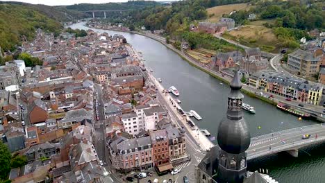 river maas in dinant, belgium with famous highway n97 bridge in background filmed from above