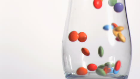 close up of candies falling in super slow motion