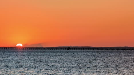 Bright-and-vibrant-sunrise-over-Red-Sea,-handheld-view