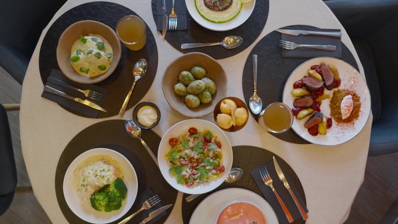 Gourmet Dinner Table with Various Dishes