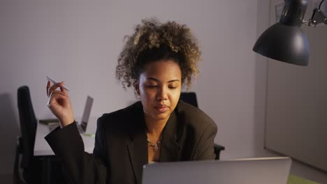 woman working late at night on laptop