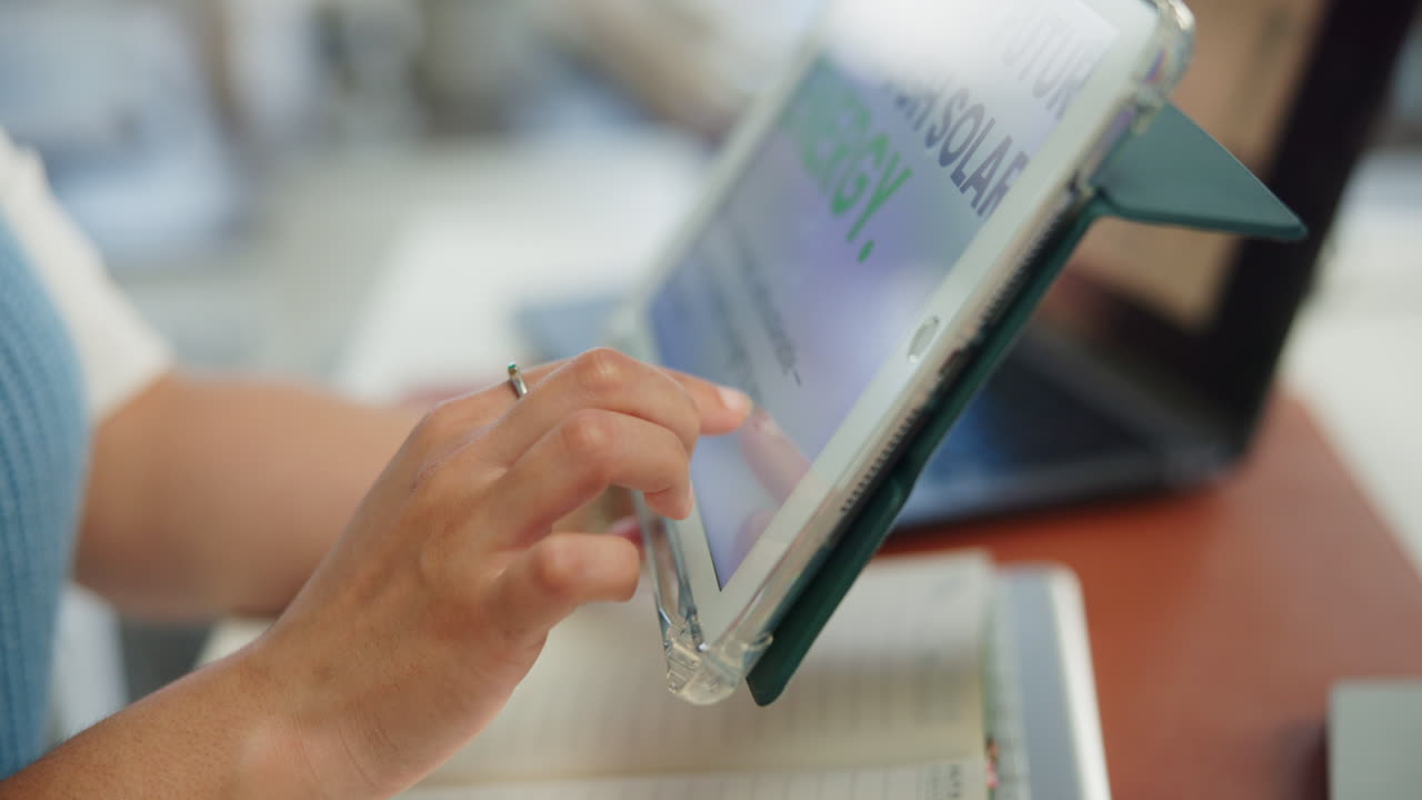 Close-up of Hand Tapping and Swiping on Digital Tablet Screen