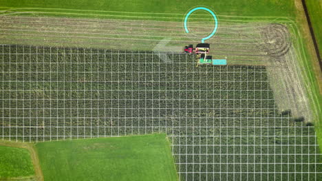 modern tractor drives over an agricultural field with digital hud elements for digital ai improvement and agriculture of the future, aerial drone birds eye view