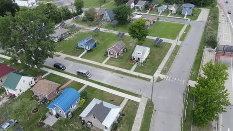 aerial revealing drone shot of cass community tiny homes project with solar panels in detroit michigan, usa