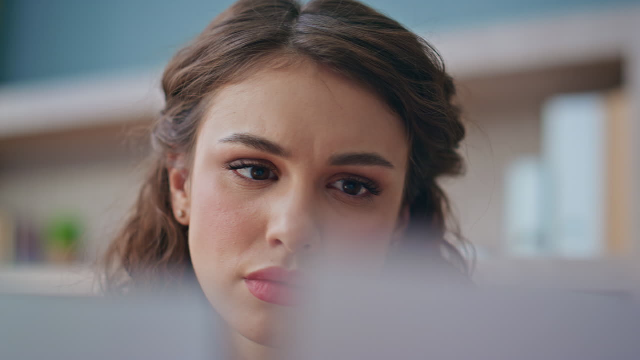 Focused woman reading papers in office closeup. Worried girl analysing documents