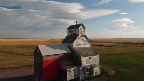 Grain-Elevator-at-Raley,-Alberta,-Orbiting-Aerial-drone-shot-of-historical-grain-elevator