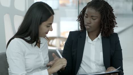 young businesswomen working with papers