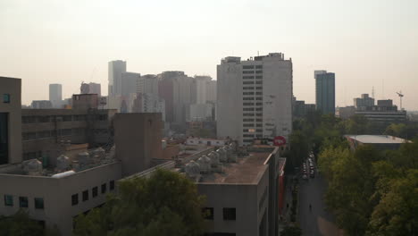 Morning-drone-flies-over-housing-estate-in-town.-Various-building-standing-together.--Mexico-city,-Mexico.