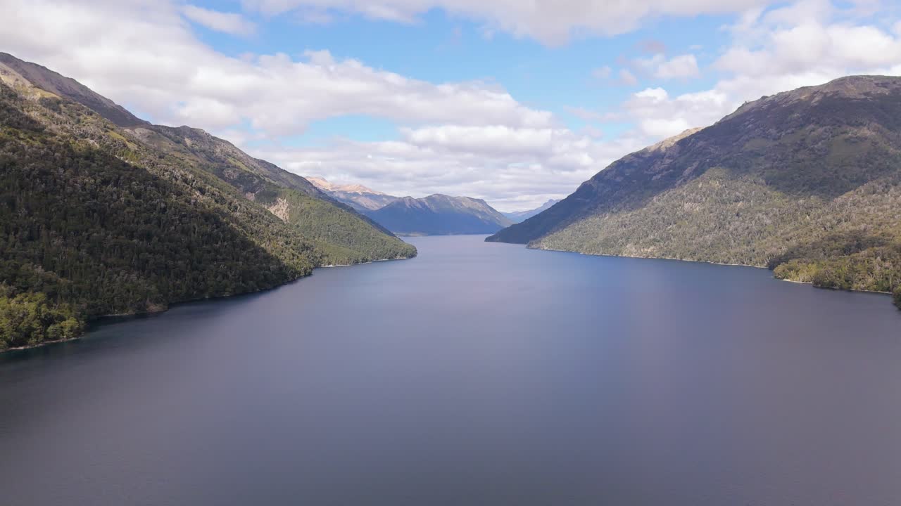 Tranquil mountain lake surrounded by forested hills in Pichi Traful, Argentina