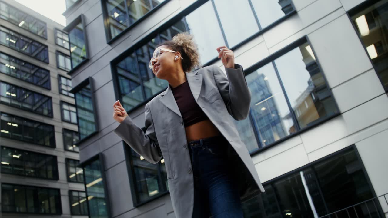 Woman dancing in a city