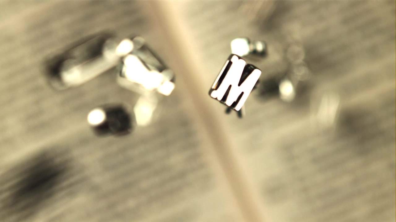 Slow Motion of Vintage Metal Letters Falling onto a Book Page