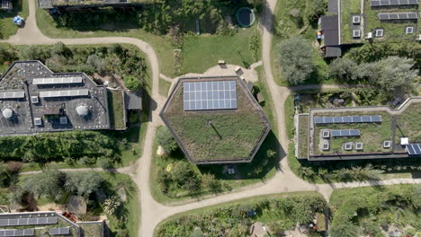 high top down lift up of beautiful green earthship village