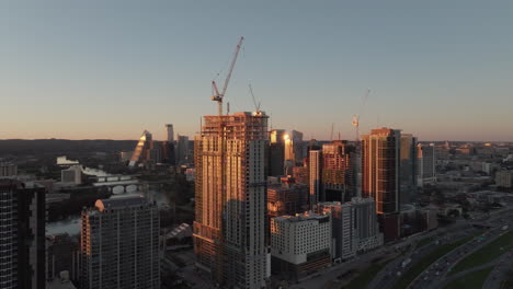 skyscraper construction with cranes and high-rise buildings in modern american city