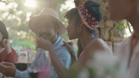 best friends eating dinner funny asian man tasting mediterranean food making faces enjoying summer celebration party sitting at table outdoors at sunset 4k