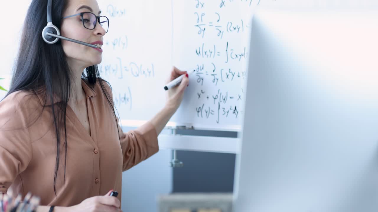Female Instructor Teaching Mathematics Remotely with Headset